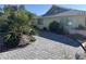 Beautifully paved driveway complemented by desert landscaping, showcasing the home's inviting entrance at 1819 Beverly Way, Las Vegas, NV 89104