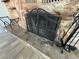 Stone fireplace with decorative iron screen and hearth at 1819 Beverly Way, Las Vegas, NV 89104