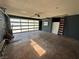 Spacious two-car garage featuring an insulated garage door, storage cabinets, and ample room for parking and projects at 1819 Beverly Way, Las Vegas, NV 89104