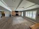 Bright living room with tile floors, stone fireplace, and large windows at 1819 Beverly Way, Las Vegas, NV 89104