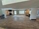 Spacious living room features a stone fireplace, wood floors, and natural light at 1819 Beverly Way, Las Vegas, NV 89104