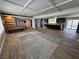Spacious open-concept living area featuring wood-look flooring, a decorative fireplace, and ample natural light at 1819 Beverly Way, Las Vegas, NV 89104