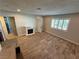 Bright living room with wood floors and an electric fireplace at 1819 Beverly Way, Las Vegas, NV 89104