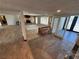 Open living area with stone fireplace and access to the exterior at 1819 Beverly Way, Las Vegas, NV 89104
