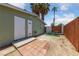 Backyard featuring a cozy patio space, rock landscaping, and perimeter fencing at 1828 Golden Arrow Dr, Las Vegas, NV 89169