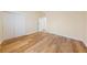 This bedroom features wood-look floors, neutral paint, and closet with sliding doors at 1828 Golden Arrow Dr, Las Vegas, NV 89169