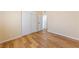 This bedroom features wood-look floors, neutral paint, and closet with sliding doors at 1828 Golden Arrow Dr, Las Vegas, NV 89169