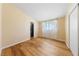 Sunny bedroom with wood floors, a closet, and a window at 1828 Golden Arrow Dr, Las Vegas, NV 89169