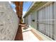 Side view of home featuring decorative breeze block and security bars at 1828 Golden Arrow Dr, Las Vegas, NV 89169