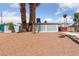 Single-story home with desert landscaping and a unique lattice accent wall at 1828 Golden Arrow Dr, Las Vegas, NV 89169