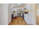 Charming kitchen featuring white cabinets, modern appliances, and quartz countertops at 1828 Golden Arrow Dr, Las Vegas, NV 89169