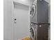 Modern laundry area with stacked washer and dryer at 1828 Golden Arrow Dr, Las Vegas, NV 89169