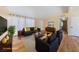 Staged living room featuring contemporary furnishings and ample natural light at 1828 Golden Arrow Dr, Las Vegas, NV 89169