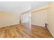 Open living space with wood-look floors, and seamless flow to adjacent rooms at 1828 Golden Arrow Dr, Las Vegas, NV 89169