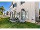 Backyard featuring well maintained lawn, patio area with seating, basketball court and beautiful desert landscaping at 2090 Eaglepath Cir, Henderson, NV 89074