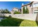 Great backyard featuring well maintained lawn, privacy wall and basketball court at 2090 Eaglepath Cir, Henderson, NV 89074
