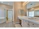 Bright bathroom with double sinks, soaking tub, and separate glass-enclosed shower at 2090 Eaglepath Cir, Henderson, NV 89074