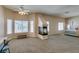 Spacious main bedroom with a vaulted ceiling, a decorative fireplace, and bright light from surrounding windows at 2090 Eaglepath Cir, Henderson, NV 89074