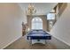 Lovely game room with chandelier, pool table, and plenty of space at 2090 Eaglepath Cir, Henderson, NV 89074