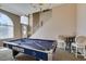 Spacious game room with natural lighting, and a pool table at 2090 Eaglepath Cir, Henderson, NV 89074