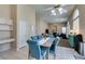 Open-concept kitchen and dining area with tile flooring and bright natural light at 2090 Eaglepath Cir, Henderson, NV 89074