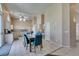 Bright eat-in kitchen with tile flooring, granite countertops, and modern ceiling fan at 2090 Eaglepath Cir, Henderson, NV 89074