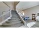 Carpeted living room featuring a staircase, chandelier, and a pool table for entertainment at 2090 Eaglepath Cir, Henderson, NV 89074