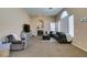 Bright living room showcasing neutral tones, large sectional sofa, and fireplace at 2090 Eaglepath Cir, Henderson, NV 89074