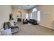 Comfortable living room with lots of natural light, fireplace, and seating at 2090 Eaglepath Cir, Henderson, NV 89074
