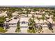 Charming street view featuring well-maintained houses with landscaped front yards and palm trees at 2090 Eaglepath Cir, Henderson, NV 89074