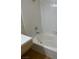 Close-up of a bathtub with white tiled walls and shower head at 2110 Los Feliz St # 2037, Las Vegas, NV 89156