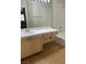 Bright bathroom with a white tiled shower and a vanity with ample counter space at 2110 Los Feliz St # 2037, Las Vegas, NV 89156