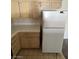 Kitchen features cabinets, white countertops and appliances including a refrigerator and stove at 2110 Los Feliz St # 2037, Las Vegas, NV 89156