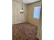 A living room featuring neutral walls, carpeted floors, and natural light from a window at 2110 Los Feliz St # 2037, Las Vegas, NV 89156
