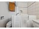 Modern bathroom featuring a walk-in tub and white tile surround at 22 Jade Cir, Las Vegas, NV 89106