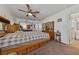 Spacious bedroom featuring a ceiling fan, and an ensuite bathroom, offering comfort and convenience at 22 Jade Cir, Las Vegas, NV 89106