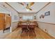 Charming dining room with a wooden table, chairs, and natural light from the window at 22 Jade Cir, Las Vegas, NV 89106
