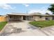 Well-maintained home features a spacious driveway and manicured lawn, perfect for Gathering and entertaining at 22 Jade Cir, Las Vegas, NV 89106