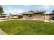 Attractive single-story home with a well-kept lawn, showcasing curb appeal and comfortable living at 22 Jade Cir, Las Vegas, NV 89106