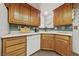 Bright kitchen featuring wood cabinets, white countertops, and a window over the sink at 22 Jade Cir, Las Vegas, NV 89106