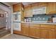 Kitchen featuring wooden cabinetry, double wall oven, and tiled backsplash at 22 Jade Cir, Las Vegas, NV 89106