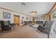 Spacious living room with comfortable seating, a ceiling fan, and wood trim details at 22 Jade Cir, Las Vegas, NV 89106