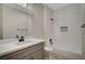 Stylish bathroom featuring a shower over tub, vanity and mirror at 2603 Savannah Springs Ave, Henderson, NV 89052