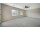 Large bedroom with neutral carpet, ceiling fan and generous space at 2603 Savannah Springs Ave, Henderson, NV 89052