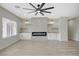 Spacious living room features a modern fireplace, custom built-ins, and a large window for natural light at 2603 Savannah Springs Ave, Henderson, NV 89052