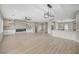 Open-concept floor plan featuring a fireplace, custom shelving, and a large kitchen island with sink at 2603 Savannah Springs Ave, Henderson, NV 89052