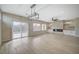 Open-concept living room with sliding door access to the backyard and custom fireplace at 2603 Savannah Springs Ave, Henderson, NV 89052
