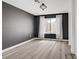 Modern bedroom features gray walls and light hardwood floors, offering a sleek aesthetic at 270 Snowy River Cir, Henderson, NV 89074