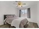Cozy bedroom featuring a ceiling fan and natural light at 270 Snowy River Cir, Henderson, NV 89074