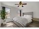 Bright bedroom featuring natural light, wood floors and modern decor at 270 Snowy River Cir, Henderson, NV 89074